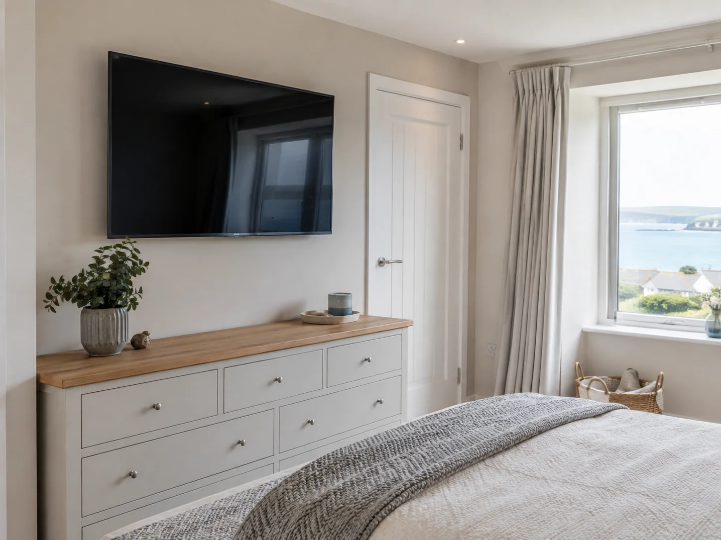 Wall mounted TV in open plan Swanage home